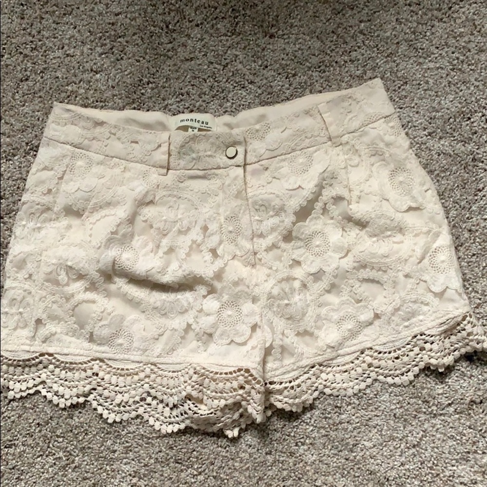 Lace fringed off white shorts